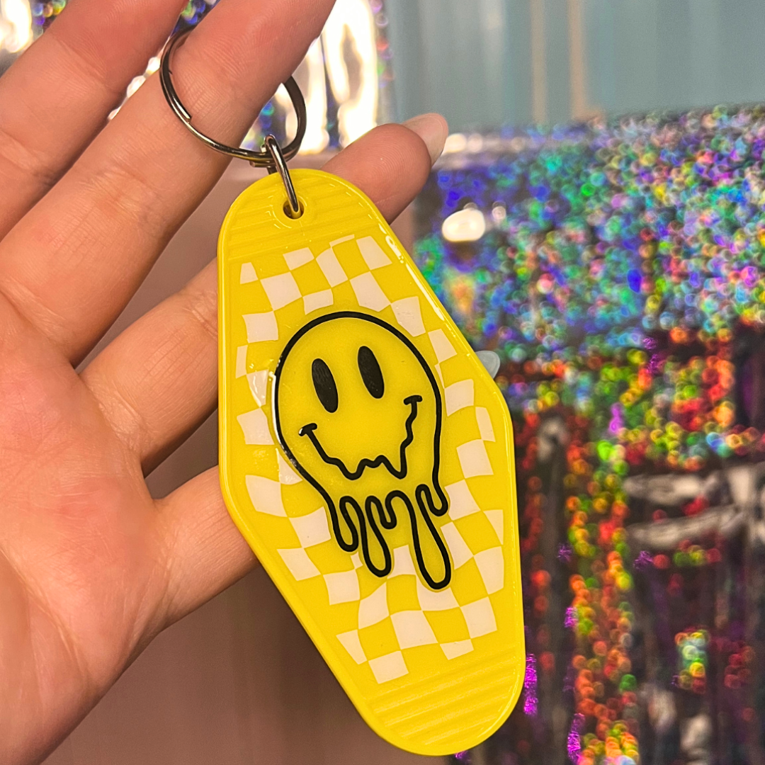 Drippy Smiley Face Motel Keychain